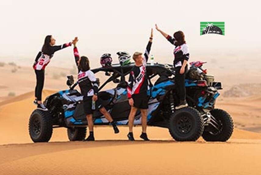 2 couples taking picture with four seater dune buggy in desert safari dubai